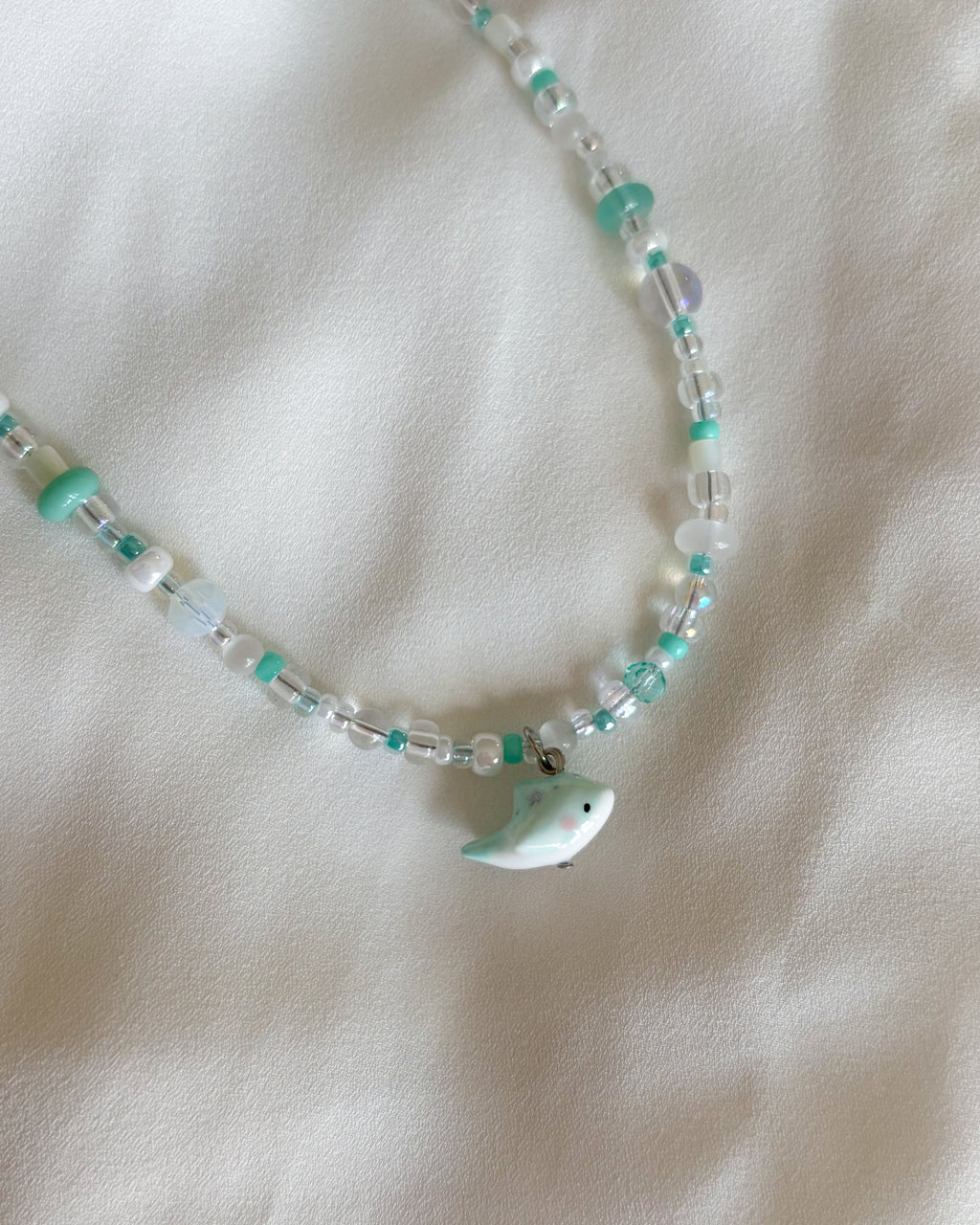 Set collane delfino verde acqua