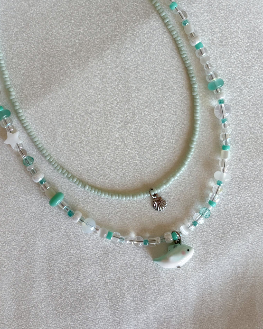 Set collane delfino verde acqua