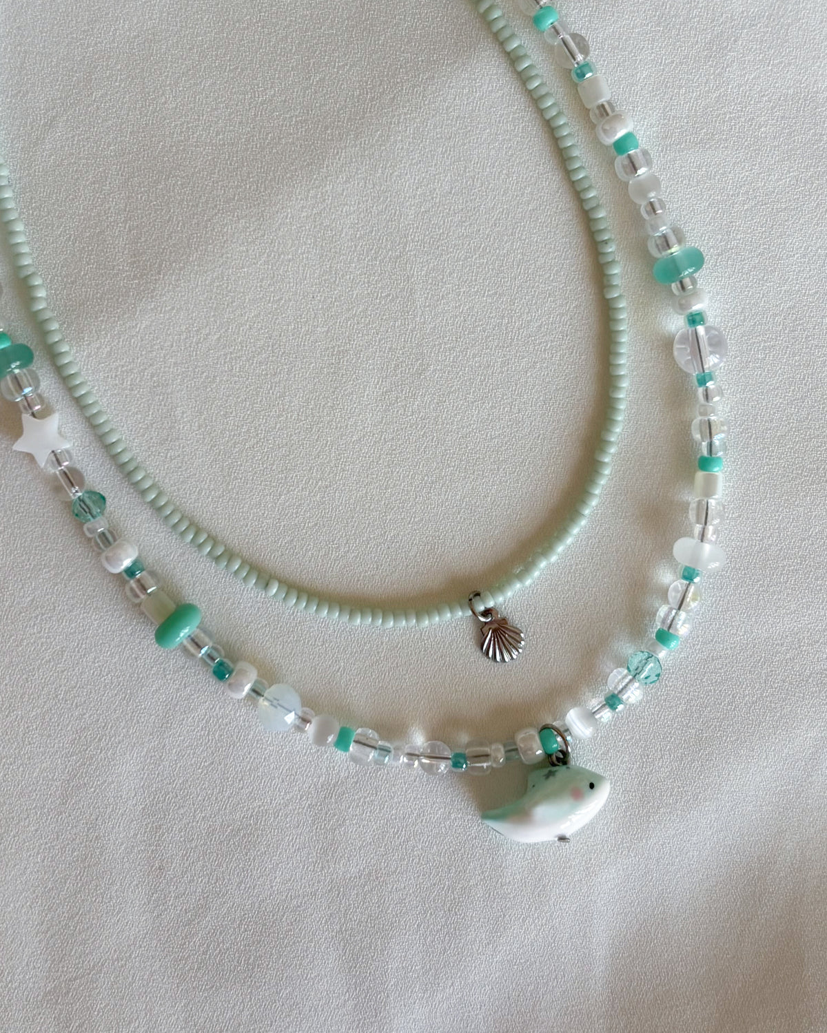Set collane delfino verde acqua