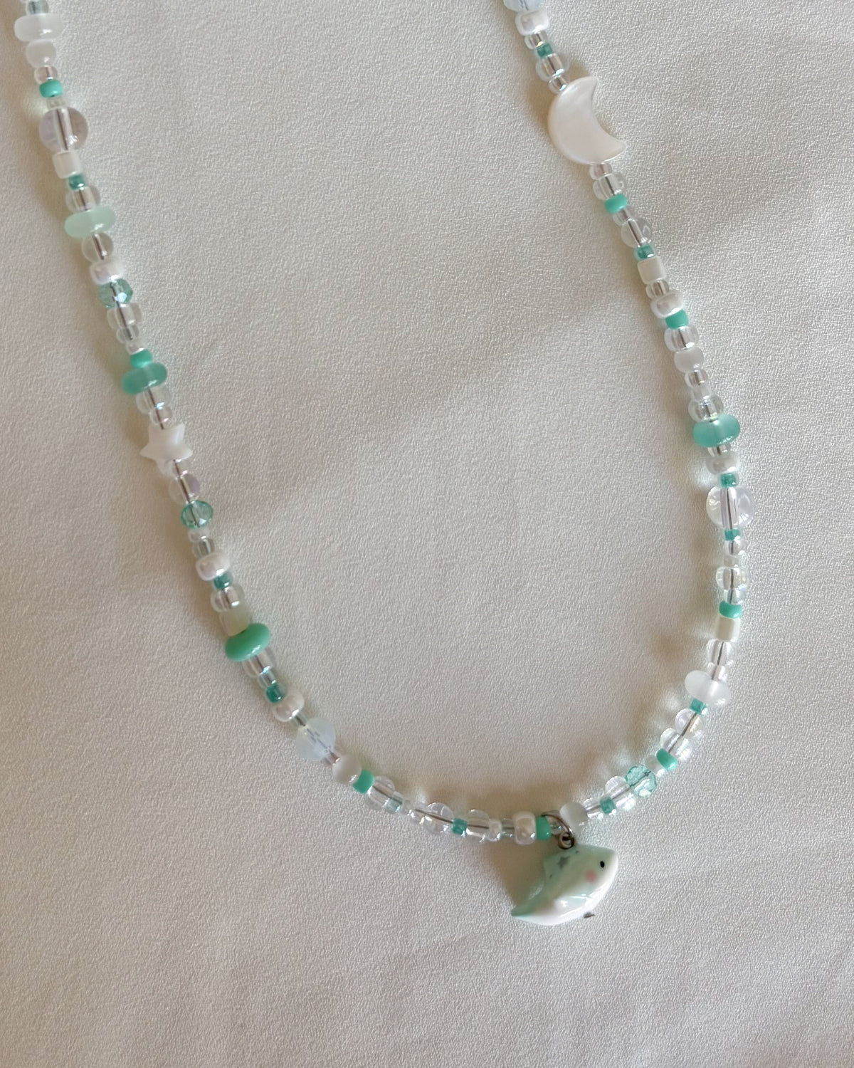 Set collane delfino verde acqua